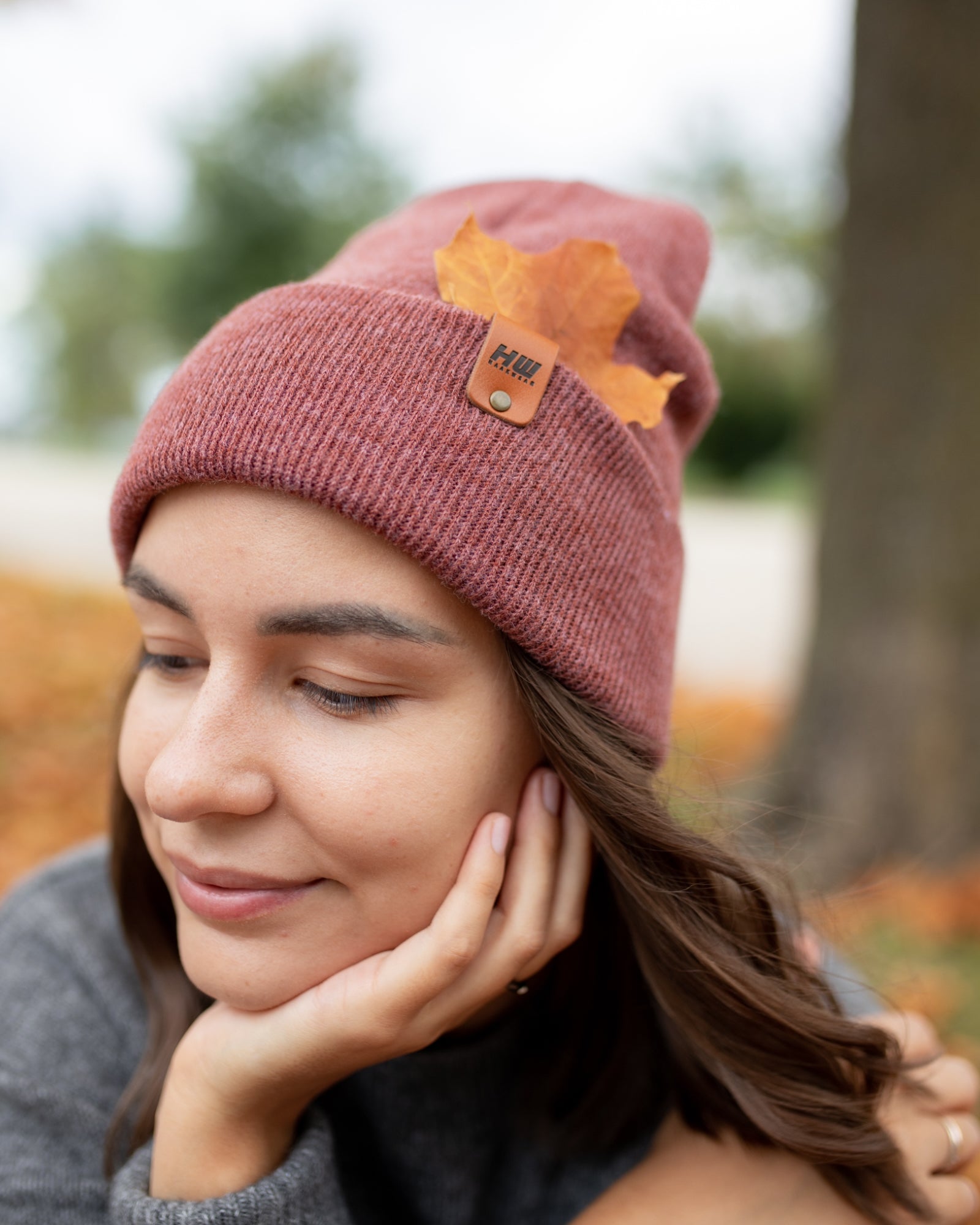 HAAKWEAR Knit Cuffed Beanie in Rusty Burgundy, showcasing its stylish design and quality craftsmanship.